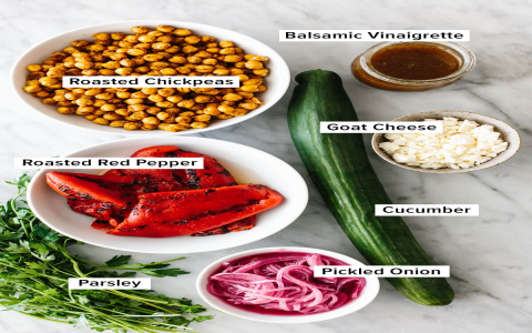 Cumin-Grilled Sea Scallops Over Chickpea Salad with Red Pepper-Tahini Vinaigrette